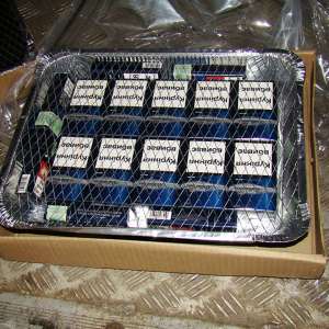 Peste 100.000  de pachete cu ţigări, ascunse într-un TIR ce transporta cărbune