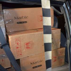 Peste 40.000 de pachete cu ţigări de contrabanda, descoperite în urma unei percheziţii