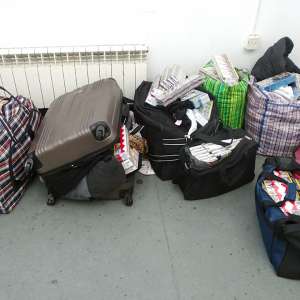 Peste 3.000 pachete cu țigări, descoperite ascunse într-un  microbuz la P.T.F. Giurgiu