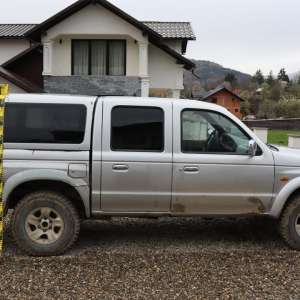 Percheziții domiciliare la Poienile de Sub Munte – cetățean român reținut pentru trafic de migranţi